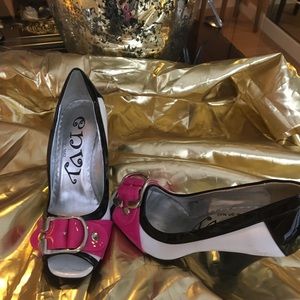 Black, white, and fuschia peep toes. Worn once.